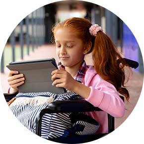 NDIS participant engaging in digital learning with support - Respected Care"